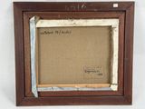an old picture frame with a picture of a cat on it