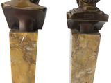pair of bronze busts of a boy and a girl on marble bases