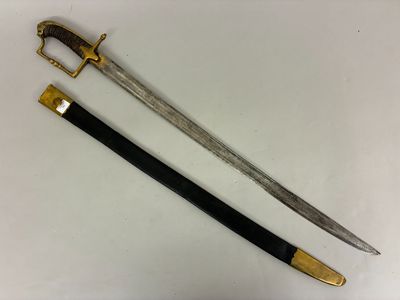 two swords with gold and black handles on a white surface