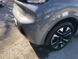 a close up of a car parked on the side of the street