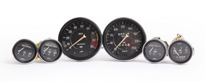 five different speedometers on a white background