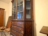 a large wooden cabinet in the corner of a room