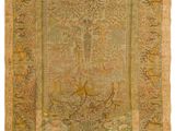 un tapis ancien représentant une femme dans un bateau