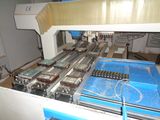 an image of a machine that is working on a piece of glass