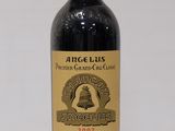 an image of a bottle of red wine sitting on a table