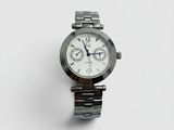 a close up of a watch on a white surface with a white background