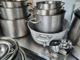 many pots and pans that are on the counter