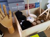 a wooden box filled with various items on a table