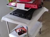 a table with a laptop and a printer on it