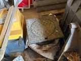 a pile of junk on the floor of a garage