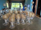 a lot of wine glasses on the table in the room
