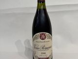 a bottle of wine that is sitting on a table