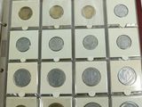 a lot of coins sitting in a box on top of a table