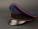 navy blue cap with pink pip on top