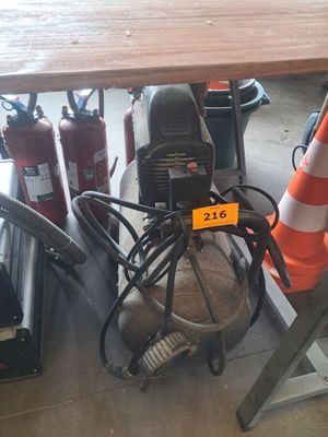 a fire hydrant under a table with a cone on it