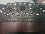 a wooden bench with flowers on it in a room