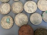 some coins are sitting on top of a table next to a coin