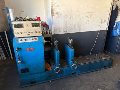 a blue machine that is sitting in a room