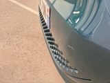 a close up view of a car ' s front grill