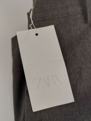 a close up of a tag on the back of a pair of pants