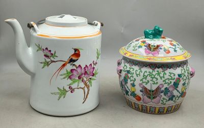 pair of chinese porcelain teapots with birds and flowers on them