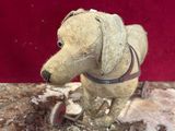 a toy dog that is sitting on top of a table