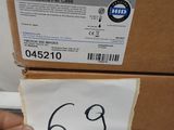 a person holding a pair of scissors in front of a box