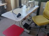 a yellow chair and a red stool in a room