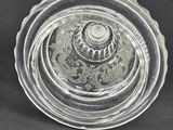 pair of clear glass vases on a black background