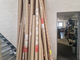a pile of baseball bats sitting in a room