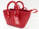 the small red basket bag has a tag on the handle