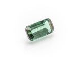 a green tourmaline gems on a white background