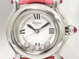 a close up of a pink watch with roman numerals on it