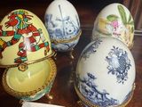 three eggs sitting on top of a wooden table next to each other