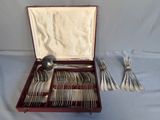 silverware in a wooden box with silverware in it