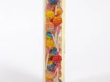 wooden lollipop holder with lollipops in it on a white background