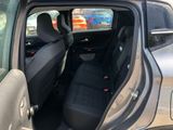 the back seat of a car with the door open