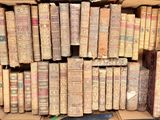a box full of old books sitting on a table