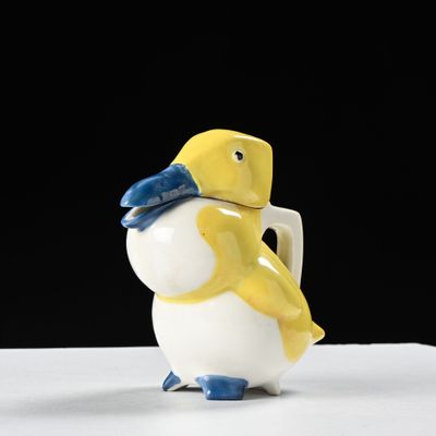 a small yellow and white bird with a blue hat on it ' s head