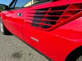 a red sports car parked in a parking lot