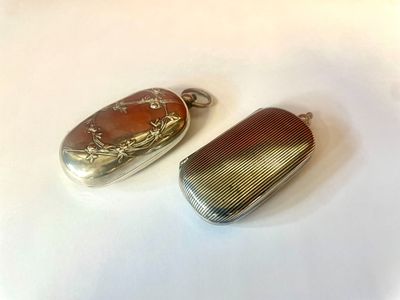 silver and carnela lockes on a white surface