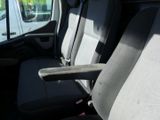 a seat in the back of a van with a arm rest