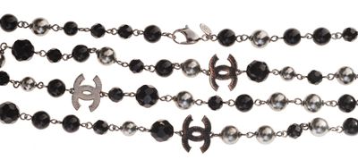 a close up of a rosary with a cross on it