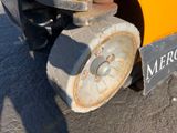 a close up of a wheel on a construction vehicle