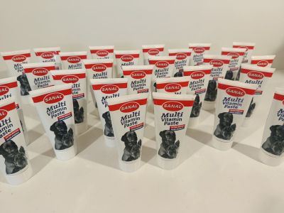 several bags of dog treats are lined up on a table