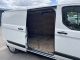 a white van with its doors open in a parking lot
