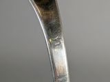 a close up of a spoon with a spoon on it