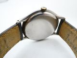 an image of a close up of a watch on a white surface