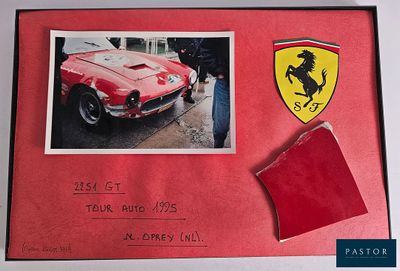 a picture of a red car with a ferrari badge on it