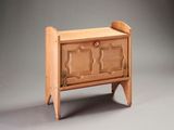 a small wooden chest with a door on it